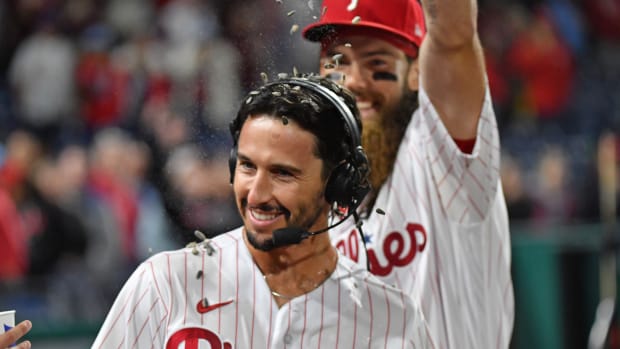 Sep 27, 2023; Philadelphia, Pennsylvania, USA; Philadelphia Phillies catcher Garrett Stubbs (21) has sunflower seeds dumped on him by center fielder Brandon Marsh (16) after win against the Pittsburgh Pirates at Citizens Bank Park. Mandatory Credit: Eric Hartline-USA TODAY Sports  